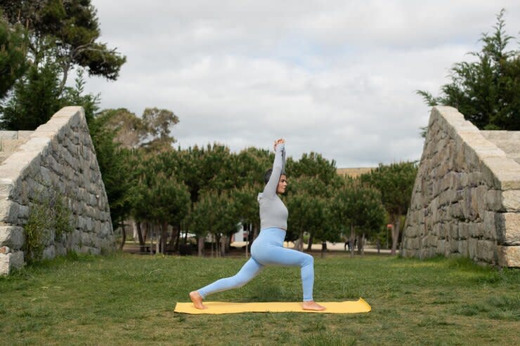 absorbed-elderly-woman-doing-yoga-park-female-model-with-short-gray-hair-exercising